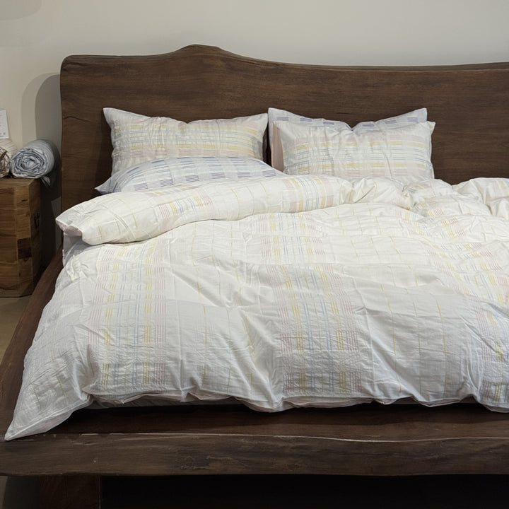 Cotton percale bedding set with a light quilted texture and subtle striped texture