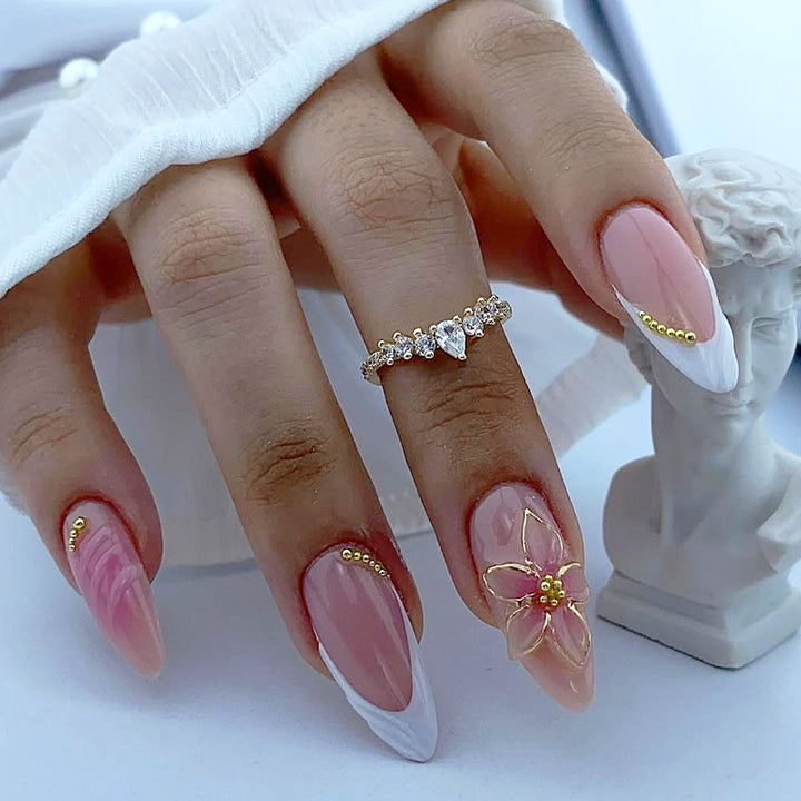 Acrylic nail set with floral design and elegant embellishments Kalsten