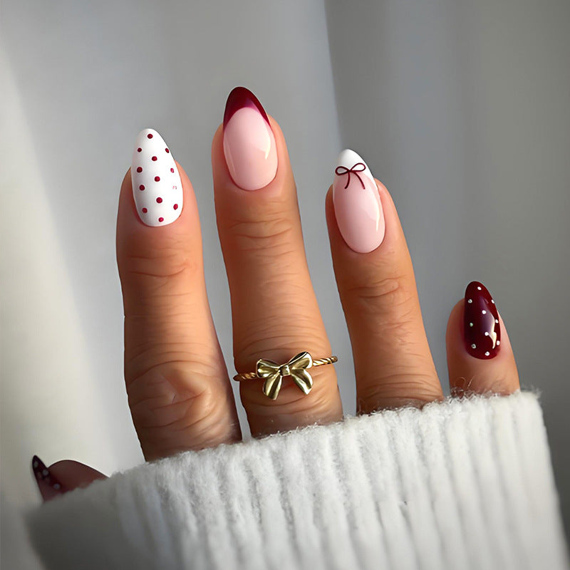 Artificial nail set with elegant bow and dot motifs Kalsten