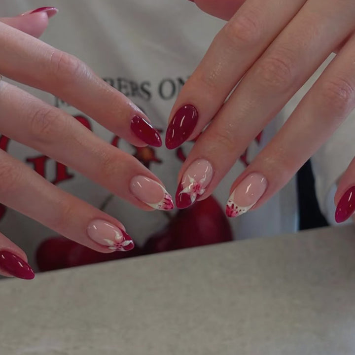 Artistic nail art with floral accents and glossy finish Kalsten