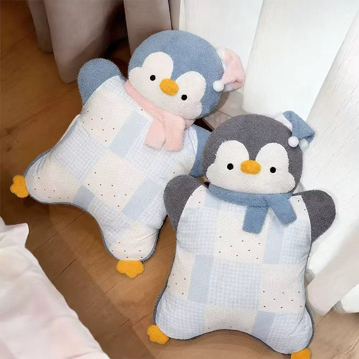Cozy plush pillow with integrated blanket in penguin look