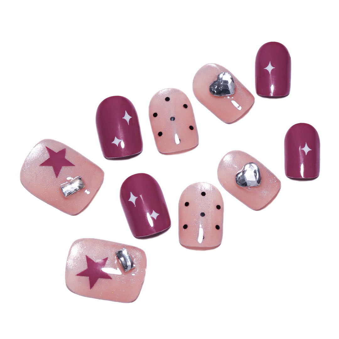 Artificial nail extensions with unique jewelry accents Kalsten