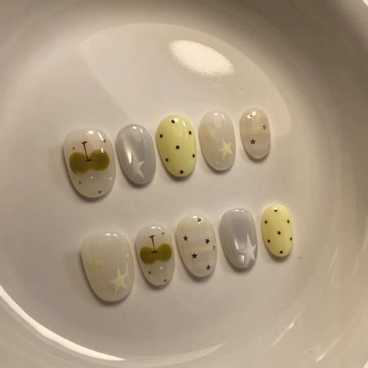 Artistic Press-On Nail Set with Whimsical Patterns