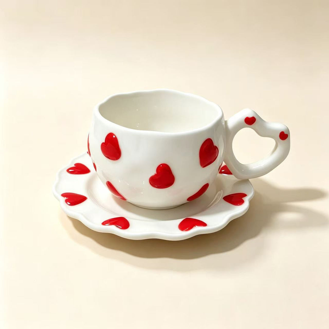 Porcelain cup set with heart-shaped handle and embossed decorative hearts