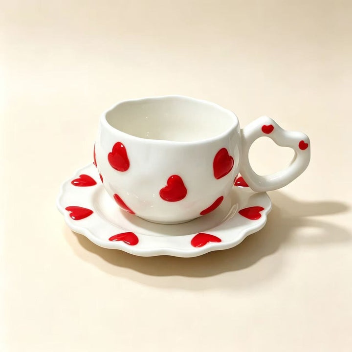 Porcelain cup set with heart-shaped handle and embossed decorative hearts
