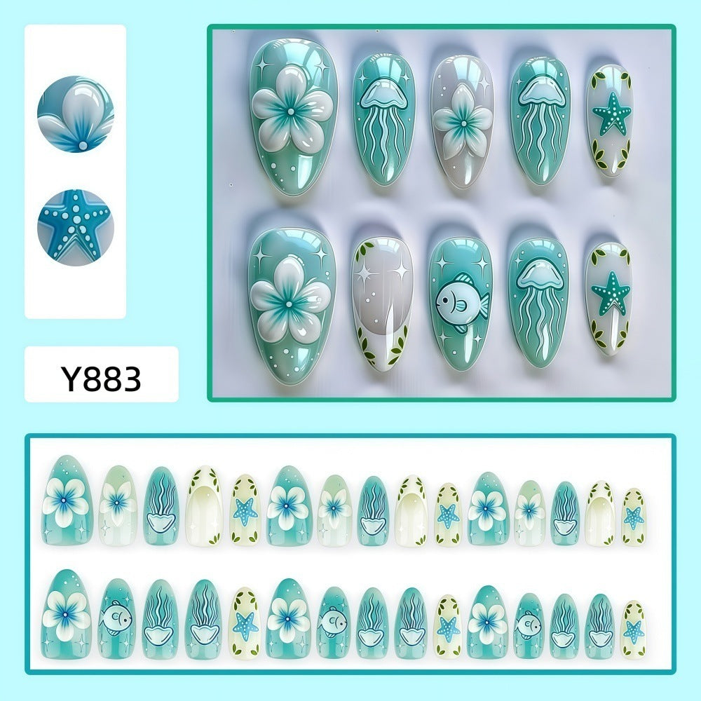Artificial nails in a maritime design with colorful shell and water motifs Kalsten