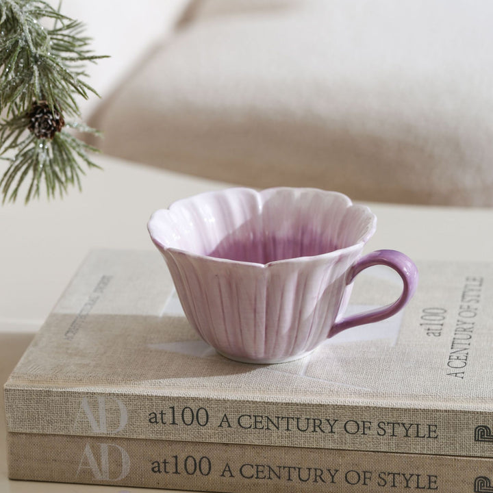 Ceramic mug with saucer in flower shape