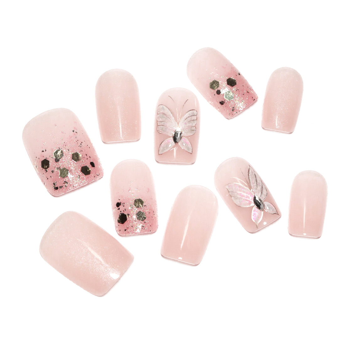 Artful nail art with butterfly designs and glitter accents Kalsten