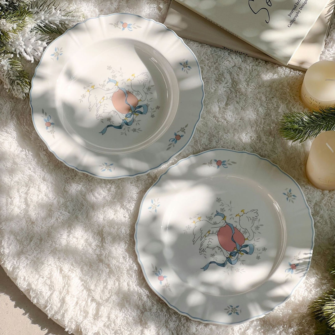 Decorative porcelain soup plate with ribbed edge and duck motif