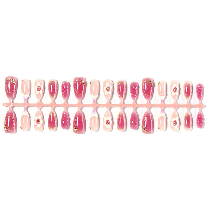 Creative acrylic nail set with floral accents and glitter decorations Kalsten