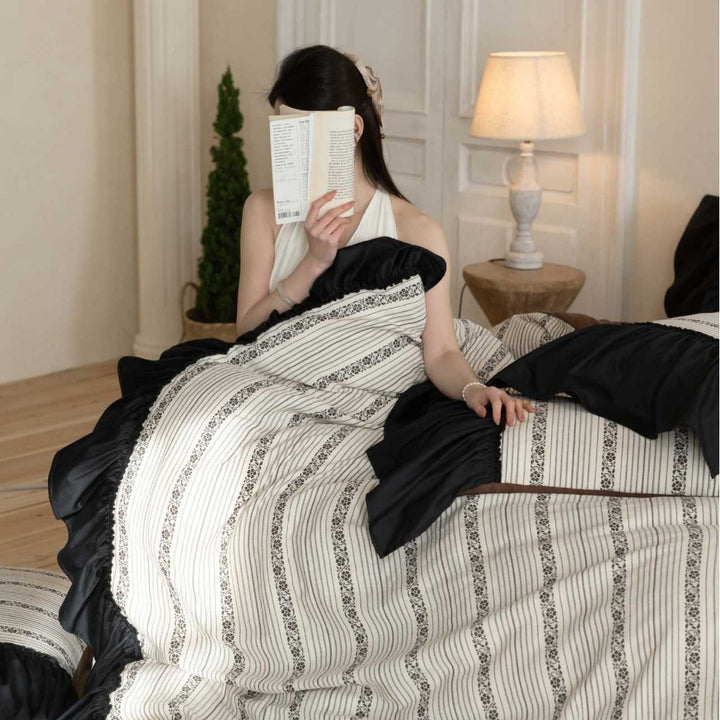 Ruffled duvet cover set with striped jacquard trim and reversible pillow