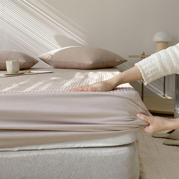 Quilted mattress topper fitted sheet with elastic all-around rubber
