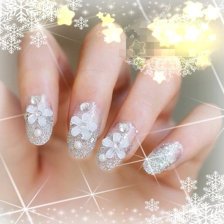 Artificials nails with sparkling rhinestone accents and elegant flower embellishments Kalsten