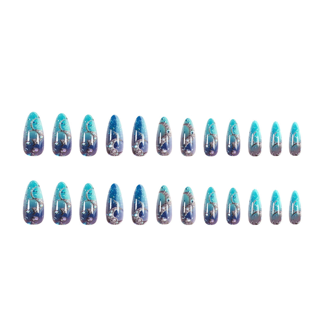 Artistic stiletto nails with glitter and marine motifs Kalsten