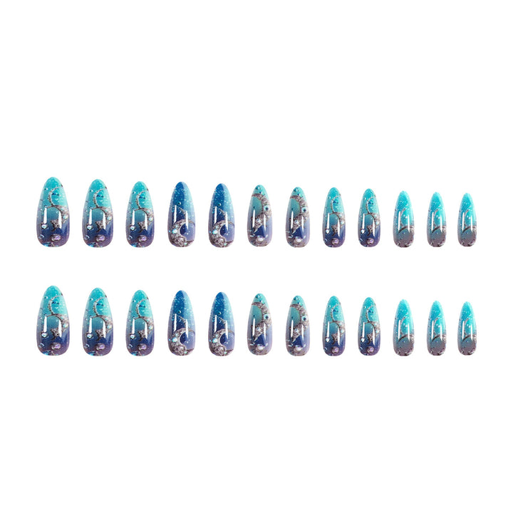 Artistic stiletto nails with glitter and marine motifs Kalsten
