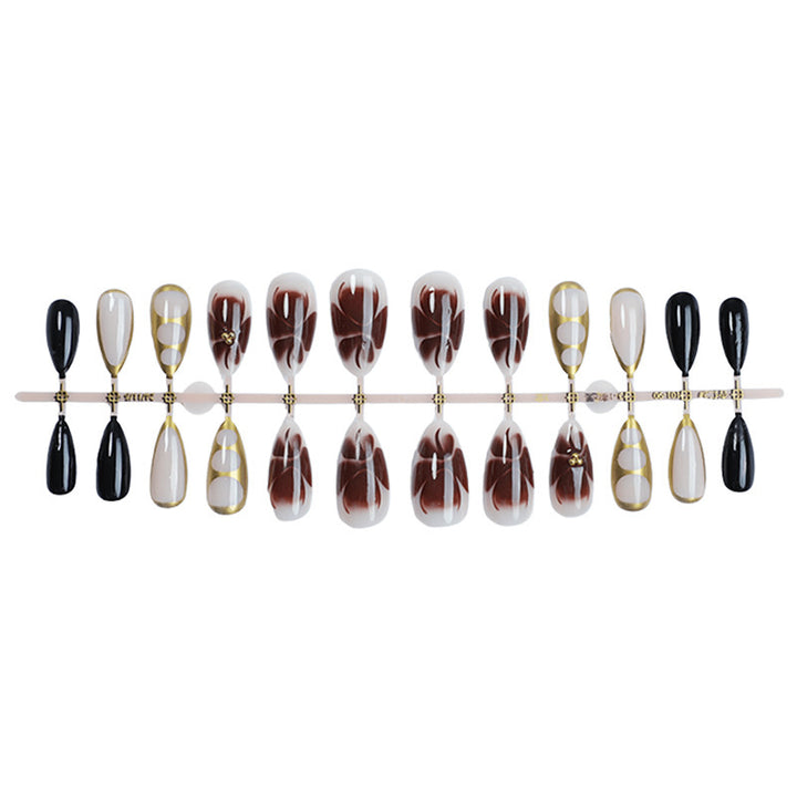 Acrylic nail set with elegant floral accents and luxurious details Kalsten