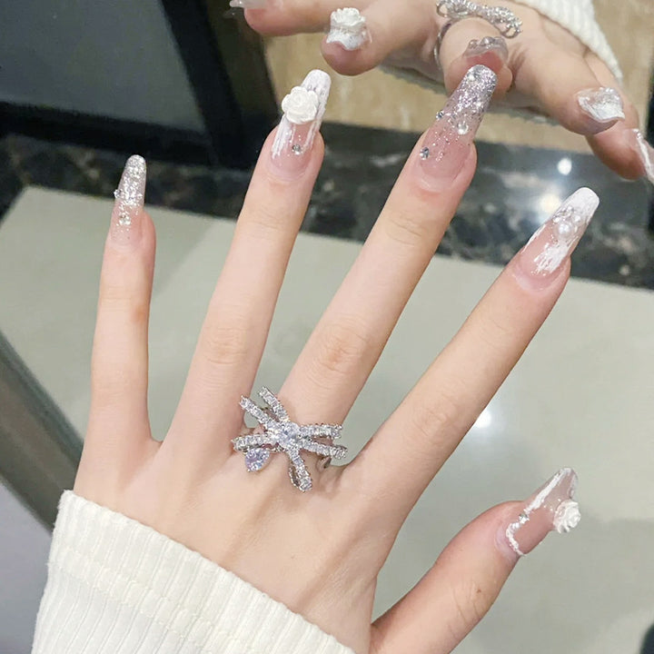 Acrylic nail set with elegant 3D flower and glitter decorations Kalsten