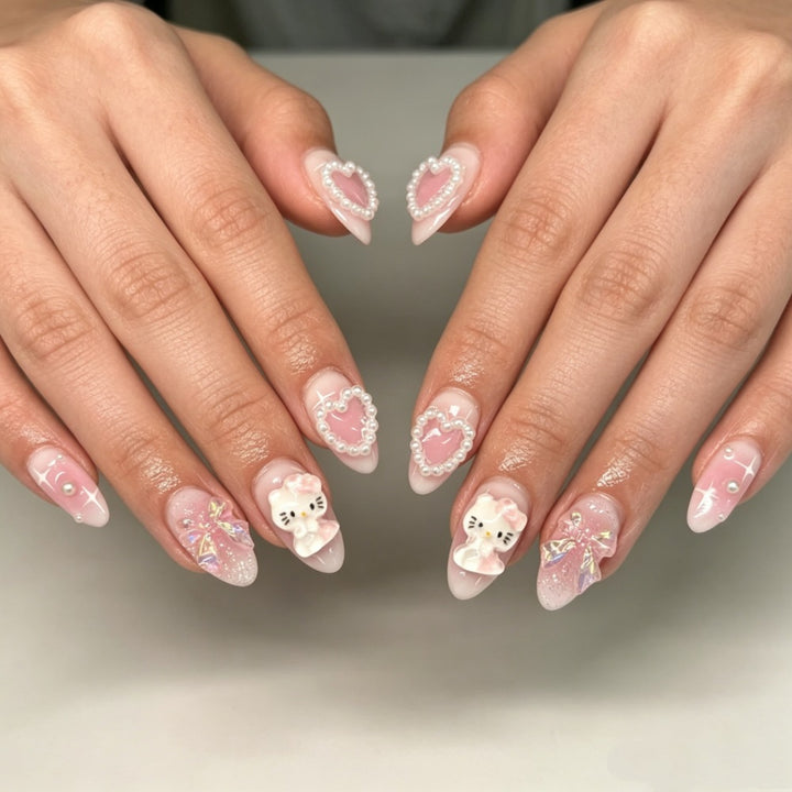 Playful artificial nails with heart and kitty motifs Kalsten