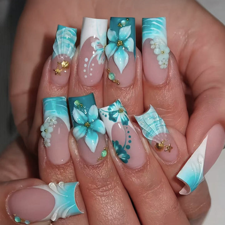 Acrylic nail set with elegant floral decorations and glitter accents Kalsten