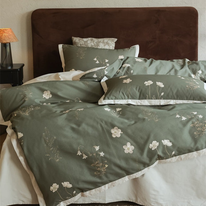 Cotton satin bedding set with subtle botanical print and contrasting hem edge