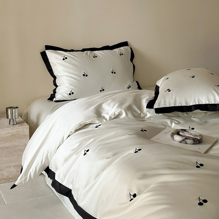 Luxurious satin bedding set with cherry embroidery and contrasting trim