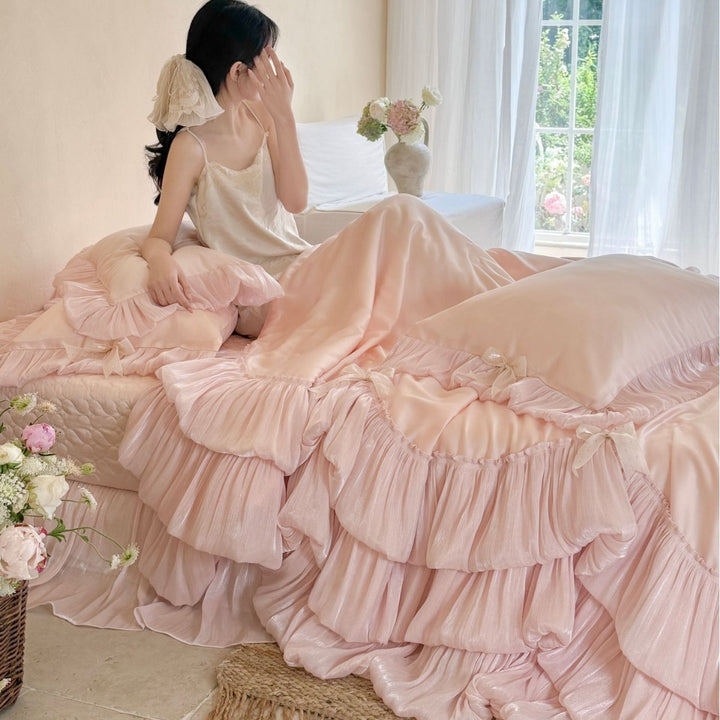 Romantic satin bedding and bedspread set with decorative ruffles and bows