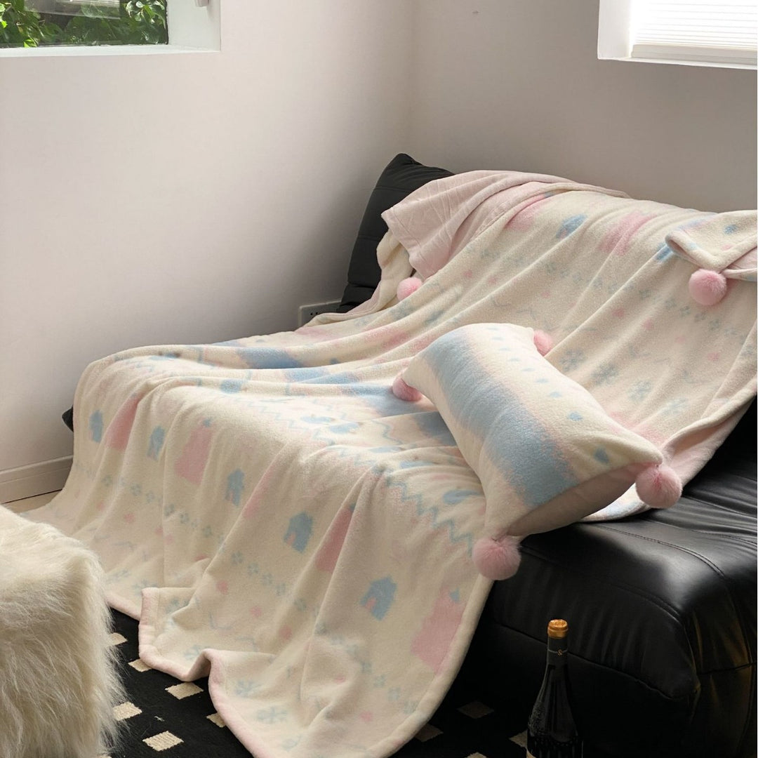 Soft blanket made of microfleece with pompom and Nordic bear pattern