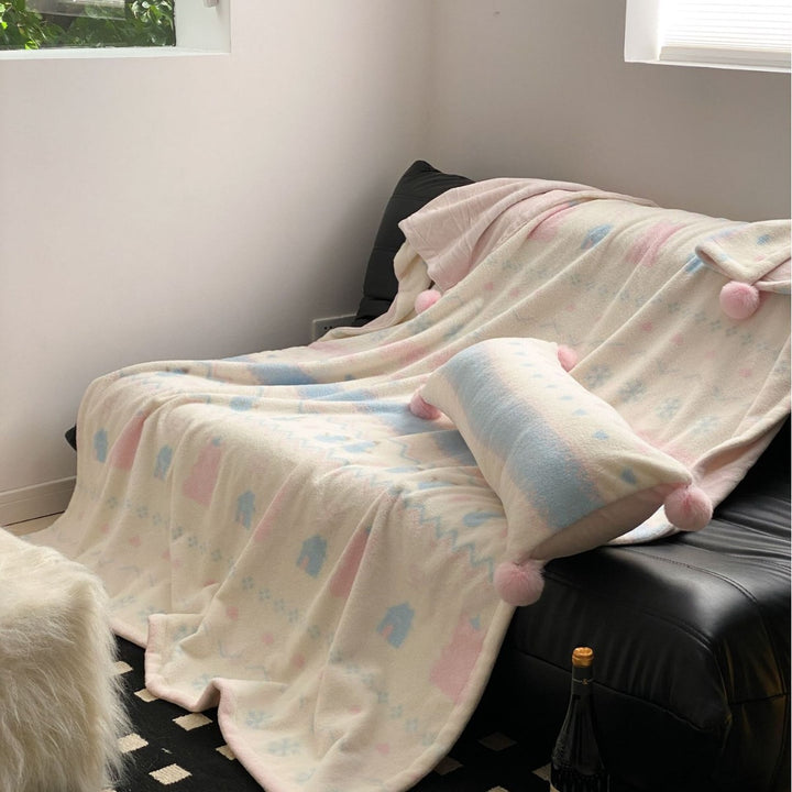 Soft blanket made of microfleece with pompom and Nordic bear pattern