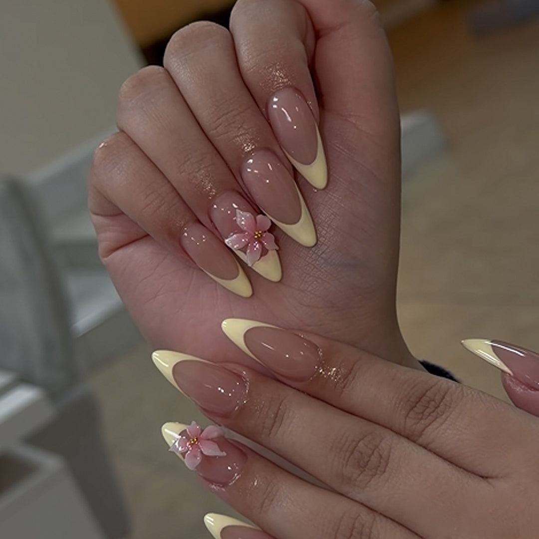 Artful stiletto nails with elegant flower accent Kalsten