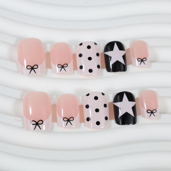 Acrylic nail set with playful dots and star motifs Kalsten