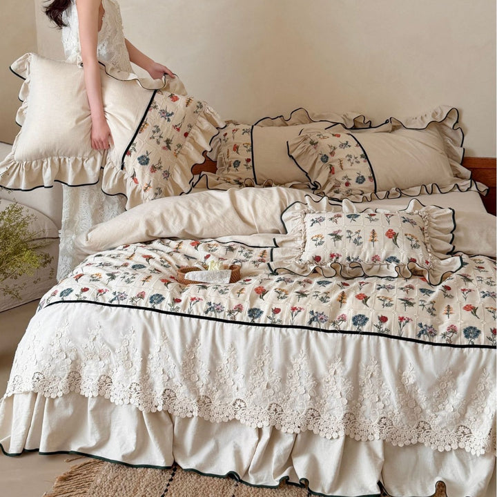 luxurious quilted bedspread set with embroidered lace and flounces