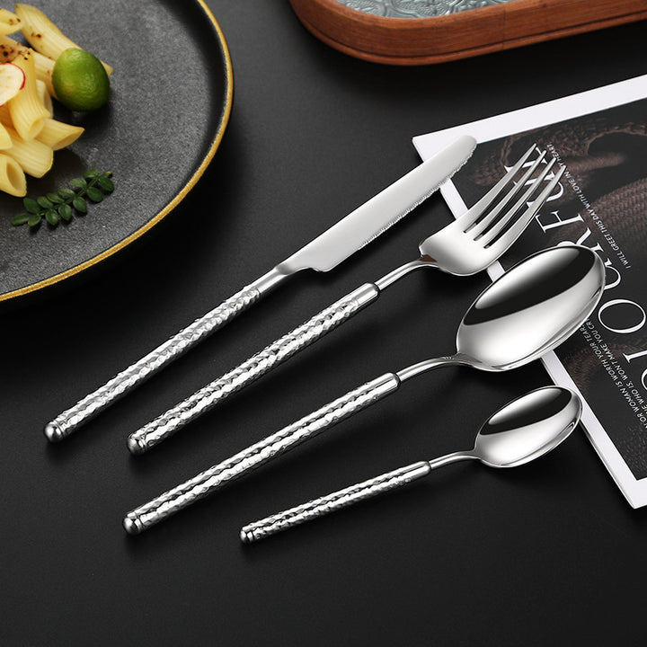 Elegant dessert spoon with elaborate handle design Kalsten