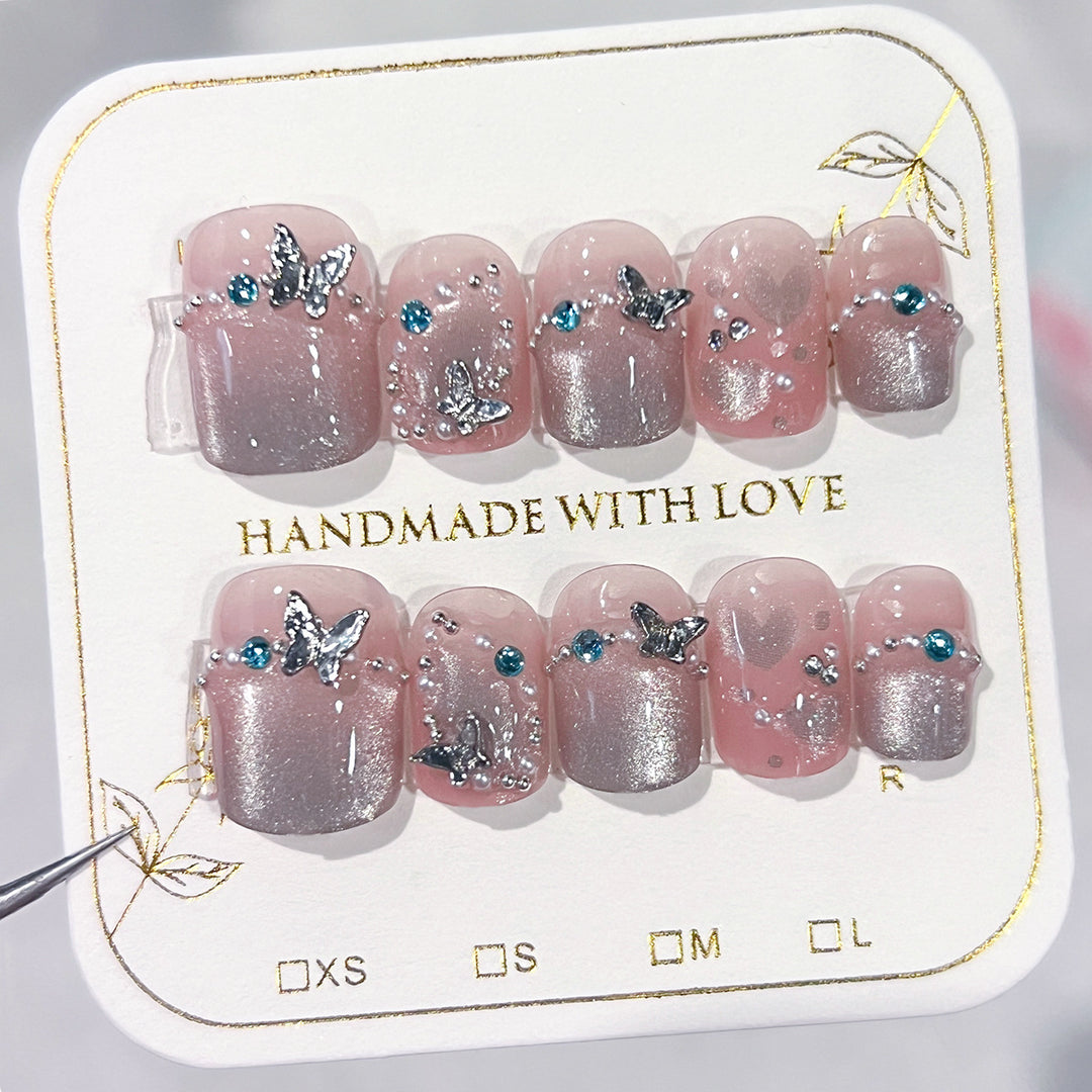 Artful artificial nails with elegant butterfly accents Kalsten