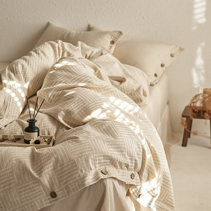 Linen-look bedding set with natural wood button closure and fine texture