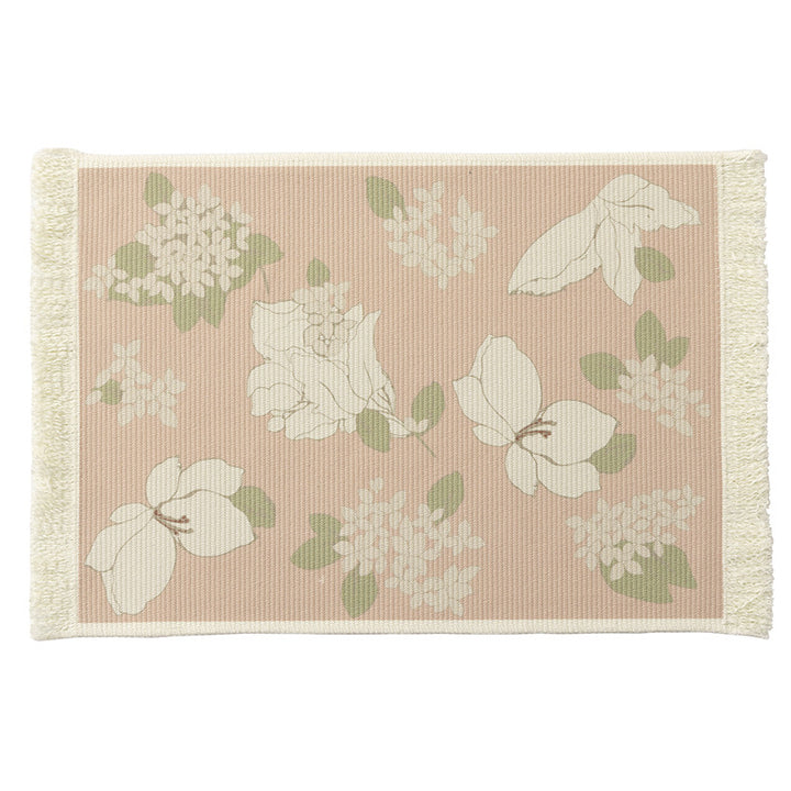 Woven table placemat made of cotton blend with olive branch print and decorative fringe edge