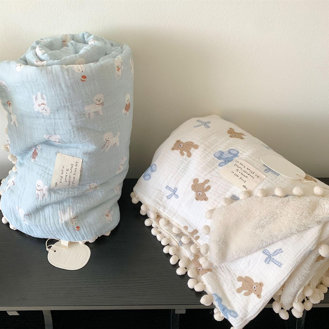 Children's Wende cuddly blanket made of cotton muslin with pompom border