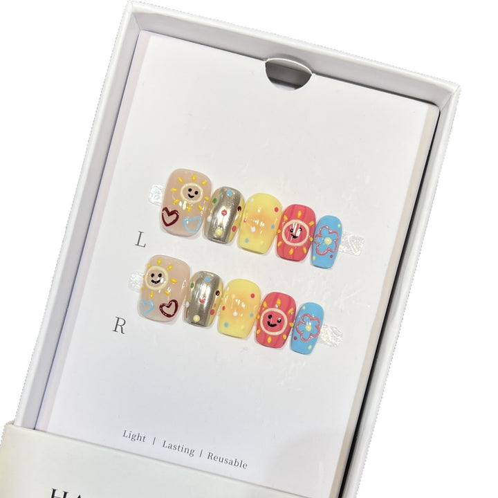 Whimsical Press-On Nail Art Set with Smiley Faces and Floral Designs Kalsten