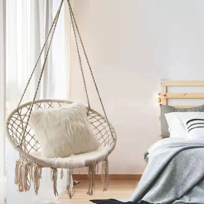 Boho macrame hanging swing chair with faux fur cushion and fringe Kalsten