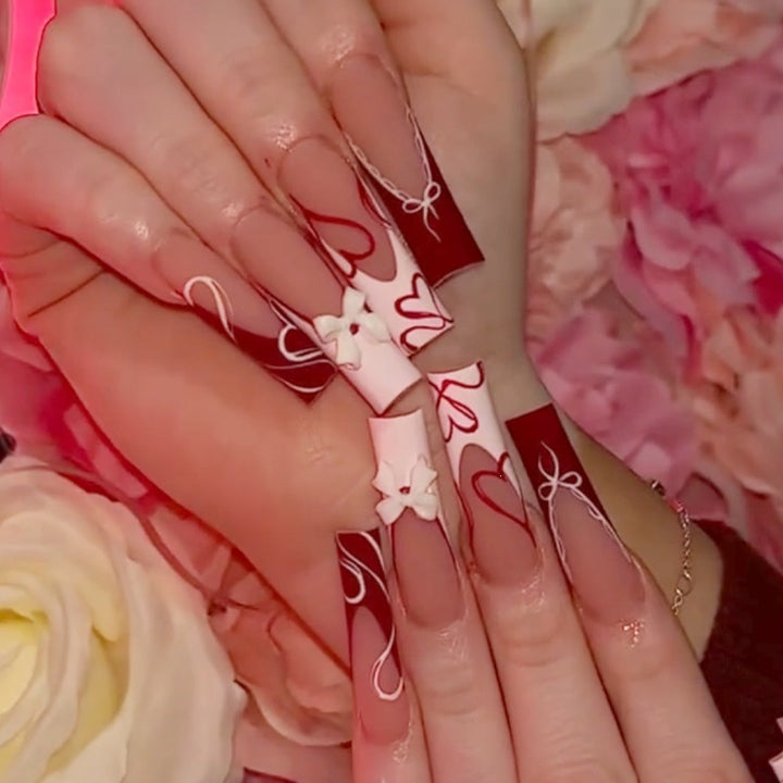 Artificial nail set with romantic heart designs and elegant patterns Kalsten