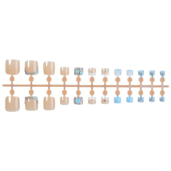 Glamorous artificial nail creation with elegant embellishments Kalsten