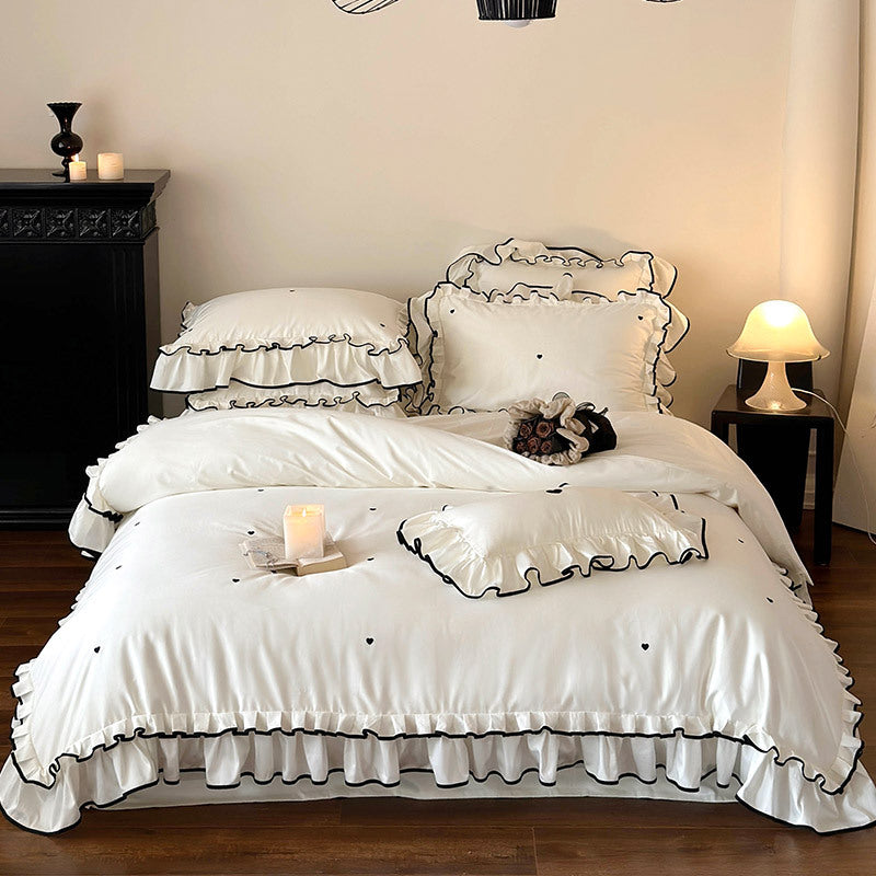 Cotton satin bed set with double-layer ruffled trim, contrast edge and heart embroidery
