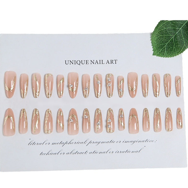 Artificial nail set with elegant gold design and sparkling applications Kalsten