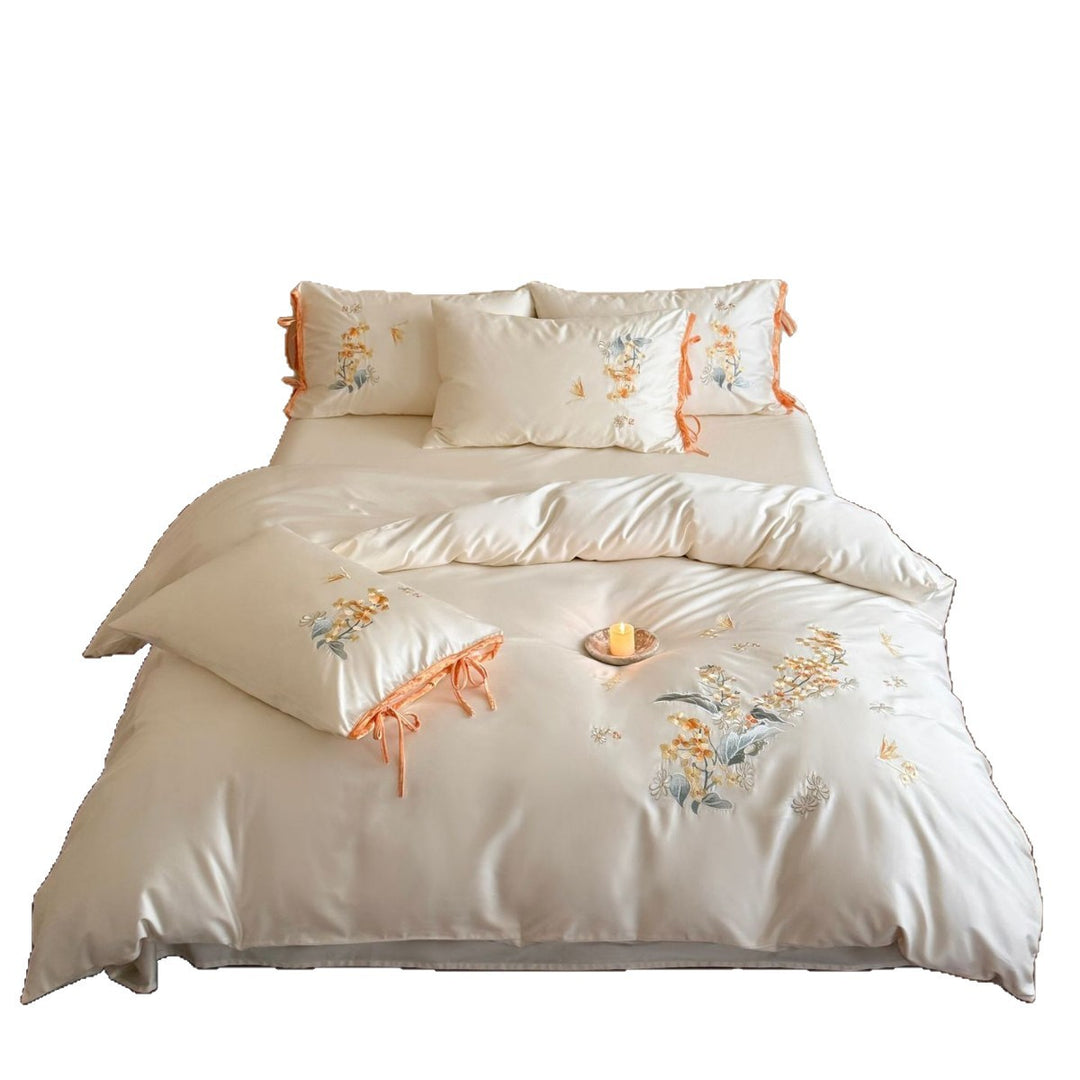 Luxurious satin bedding set with floral embroidery and bow appliqué