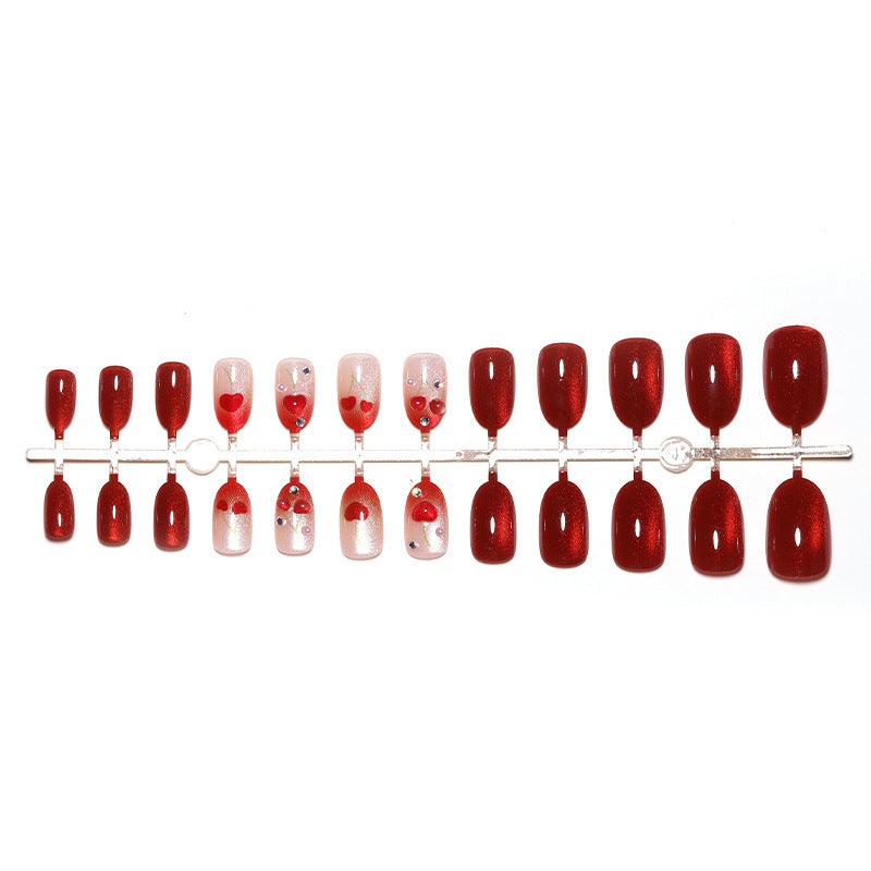 Artificial nail set with glamorous accents and creative heart motifs Kalsten