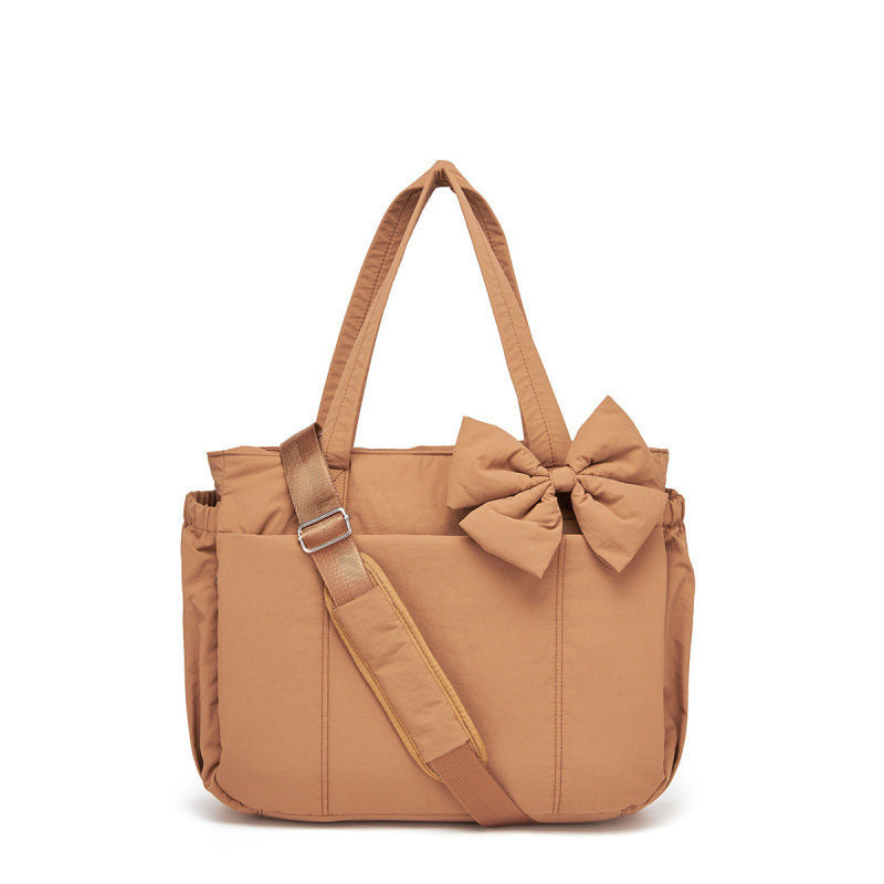 Fashionable tote bag with elegant bow appliqué Kalsten
