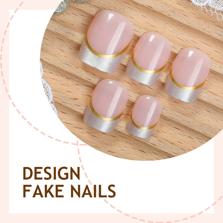 Artificial nail creations with elegant gold trim Kalsten