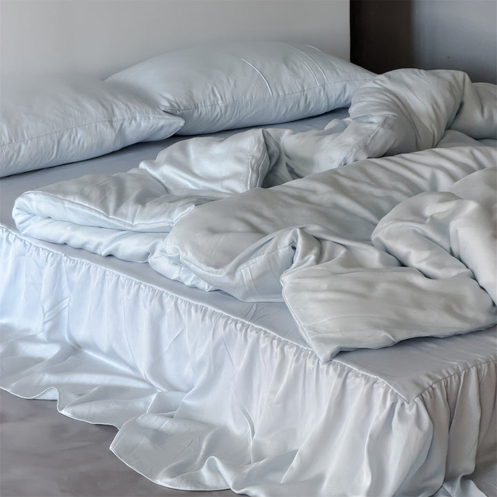 Bedding set with voluminous bed skirt and soft satin finish