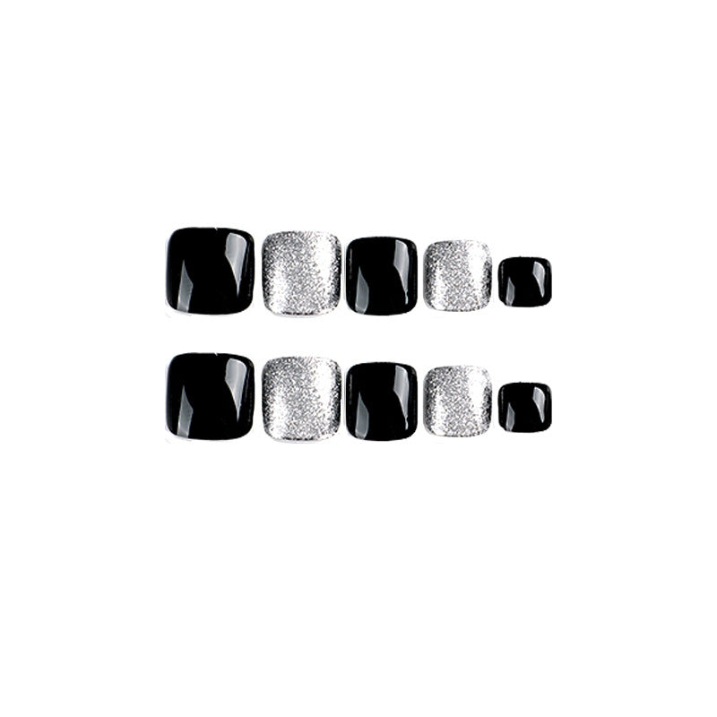Artful toenail art with glitter and black design Kalsten