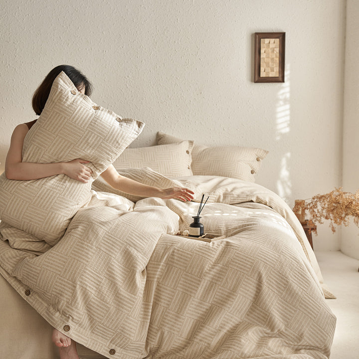 Reversible cotton bedding set with button closure and subtle geometric jacquard