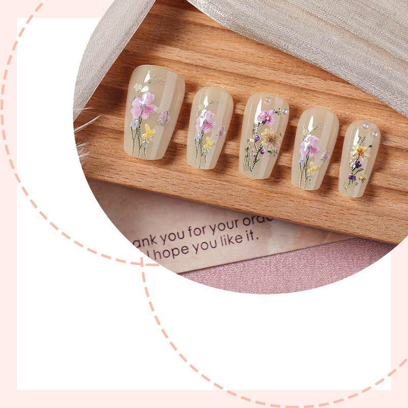 Artificial nail set with floral embellishments and glamorous details Kalsten